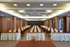 a room with rows of tables and chairs at Hisea Huahin Hotel in Hua Hin