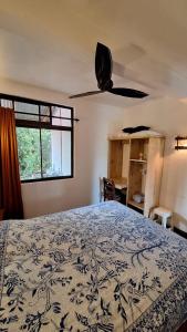 a bedroom with a bed and a window at noemi apartments samara beach A-2 in Sámara