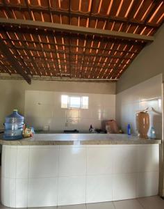 a kitchen with a counter top in a room at Casa no Paracuru in Paracuru +10 photos