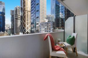 a balcony with a view of a city skyline at Central 2BR Apt by Melbourne Central City Views in Melbourne