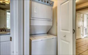 a white washer and dryer in a kitchen at Captains Watch in Tybee Island