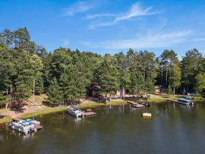 an aerial view of a lake with boats in it at Whispering Waters Bayview Resort Cabin 4 in Saint Germain