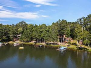 an aerial view of a lake with boats in it at Bayview Resort Waters Edge Cabin 2 in Saint Germain
