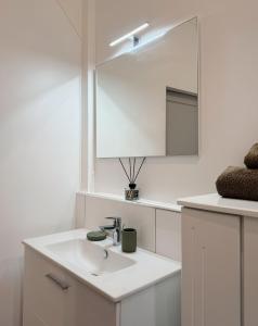 a white bathroom with a sink and a mirror at Ti kè an mwen in Pointe-Noire +23 photos
