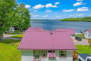 an aerial view of a house with a red roof at TB6 Thunder Bay Resort Cabin 6 in Phelps +5 photos