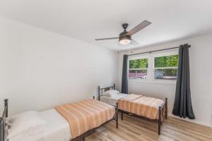 a bedroom with two beds and a window at TB-13 Thunder Bay Resort Cabin 13 in Phelps