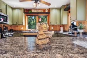 a statue of a bear on a counter in a kitchen at Clover Pines in Eagle River
