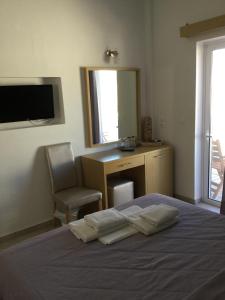 Postel nebo postele na pokoji v ubytování Rita's Place Hotel