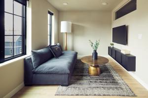 a living room with a couch and a table at The Dylin in Madison