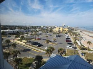 an aerial view of a parking lot next to the beach at Cuddle's Comfort & OCEAN in Daytona Beach