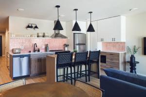 an open kitchen with a table and chairs at The Dylin in Madison