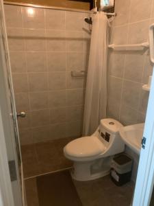 a bathroom with a toilet and a sink at Walden Moon Resort in Ko Lanta Yai
