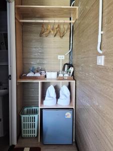 a small room with a shelf with shoes on it at Walden Moon Resort in Ko Lanta Yai