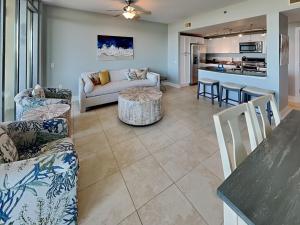 a living room with a couch and a table at Palisade Palms TW1012 - Sea Escape in Galveston