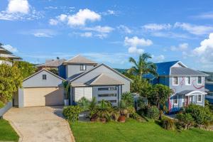 a large house with a driveway at Pacific Blue, Gerringong in Gerringong