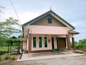 a small house with a porch at Sweethome MAMA in Kuala Terengganu