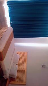 a bed on a boat with some pillows on it at Sky view Resort Shogran in Shongran