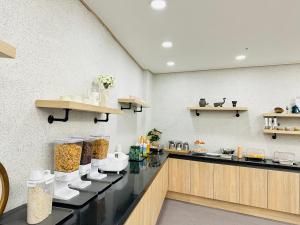 a kitchen with a counter with food on it at Bonghwang Inn BonghwangMansion2 in Gyeongju
