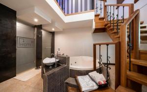 a bathroom with a sink and a staircase at R Hotel in Bucheon +49 photos