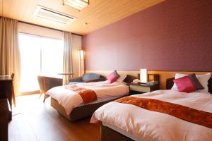 Rúm í herbergi á Hinotani Onsen Misugi Resort
