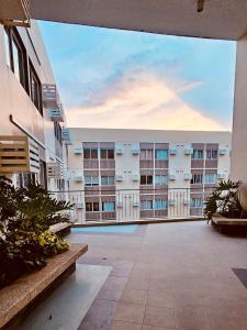 a view of an apartment building from the courtyard at Your Cozy Space in Stanford Suites 3 Brgy Inchican Silang Cavite in Silang