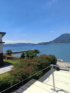 a view of a body of water from a house at Namhae Soljeong Pension in Namhae