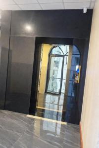 an entrance to a building with a large glass door at Ánh Mai Hotel in Bảo Lộc