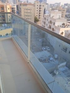 a balcony with a view of a parking lot at Aryaf Hotel Apart Tabasum Group in Ajman 