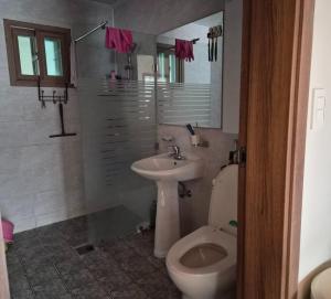 a bathroom with a toilet and a sink at Hwacheon Ujune Minbak in Hwach'ŏn