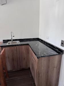a kitchen with a sink and a counter top at Termas del Vino 3 in Palmilla Abajo +6 photos