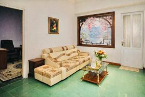 a living room with a couch and a table at Nam My Van Homestay - Thai Nguyen in Thái Nguyên