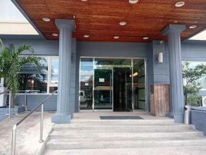 an entrance to a building with a wooden ceiling at Townhouse Oak Vera Hotel Near Clark International Airport in Angeles