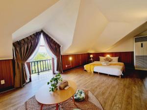 a bedroom with a bed and a large window at LumiShora Villa - Bai Truong, Phu Quoc in Phú Quốc +155 photos