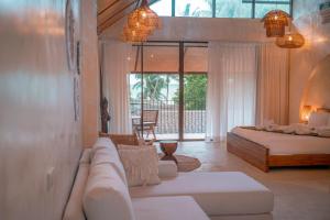 a living room with two beds and a couch at SeaTara Resort in Ko Phangan +40 photos