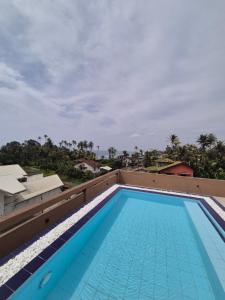 a swimming pool on the roof of a building at Sky Bloom Ahangama in Ahangama