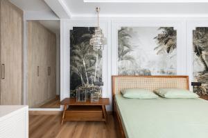 a bedroom with a bed and a chandelier at Entire 4bhk villa in Panchkula, Chandigarh in Panchkula