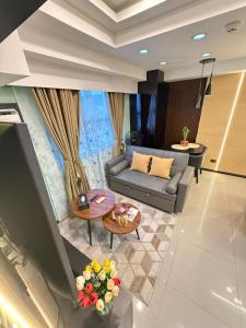 a living room with a couch and a table at LM50L2 horizon101 cebu in Cebu City