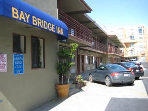 a car parked in front of a bay bridge inn at Bay Bridge Inn San Francisco in San Francisco