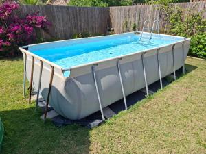 a boat sitting on the grass in a yard at Omidraai Opihoek in Boknes