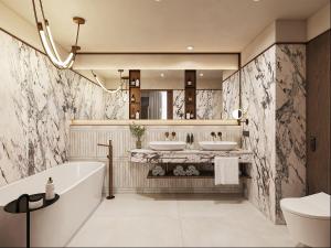 a bathroom with two sinks and a tub and a mirror at Novotel Lviv Center in Lviv +36 photos