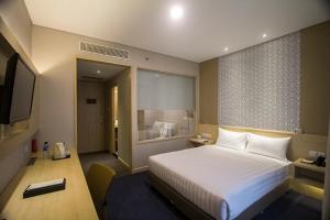 Postel nebo postele na pokoji v ubytování GTV Hotel