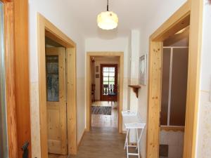a hallway of a house with wooden floors and a door at Peaceful Cottage near Ski Area in Gmünd in Gmünd in Kärnten