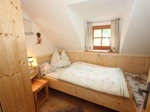 a bedroom with a bed and a window at Peaceful Cottage near Ski Area in Gmünd in Gmünd in Kärnten +35 photos