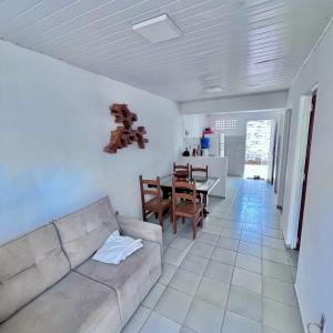 a living room with a couch and a table at Casa Barreirinhas in Barreirinhas