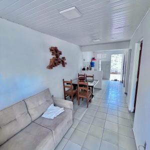 a living room with a couch and a table at Casa Barreirinhas in Barreirinhas