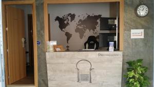 a wall with a map of the world on it at Hostal Boutique El Patio Lepe in Lepe