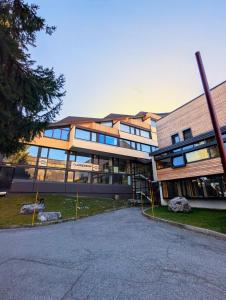 a large building with a playground in front of it at Sauna Relax in Piancavallo mountain in Piancavallo