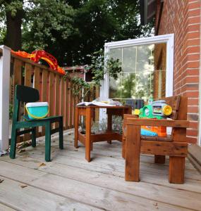 a wooden deck with a table and a chair at Ferienwohnung Am Hohen Berge in Lauenburg
