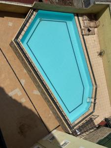 an overhead view of a large blue swimming pool at LJ Homes in Nairobi