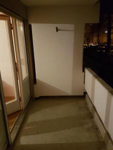 an empty room with a door and a window at Cosy Accommodation - very central in Munich